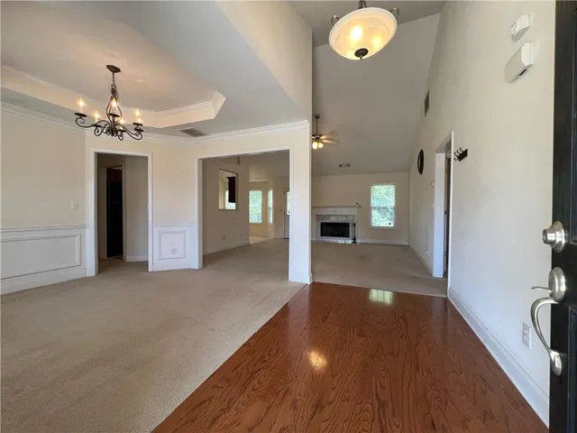 a view of empty room with fireplace