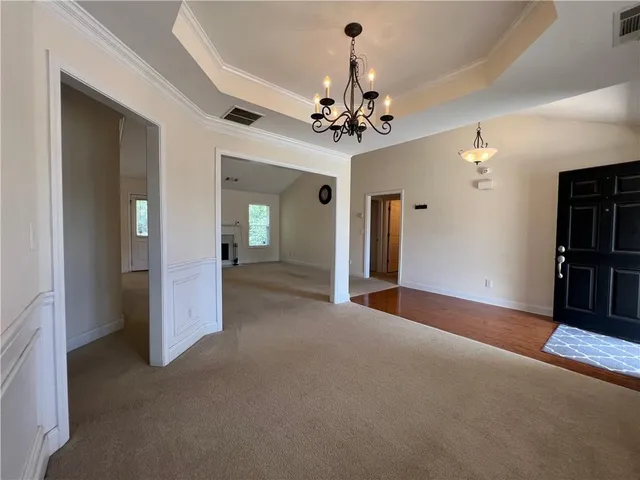 a view of a livingroom with a ceiling fan and window