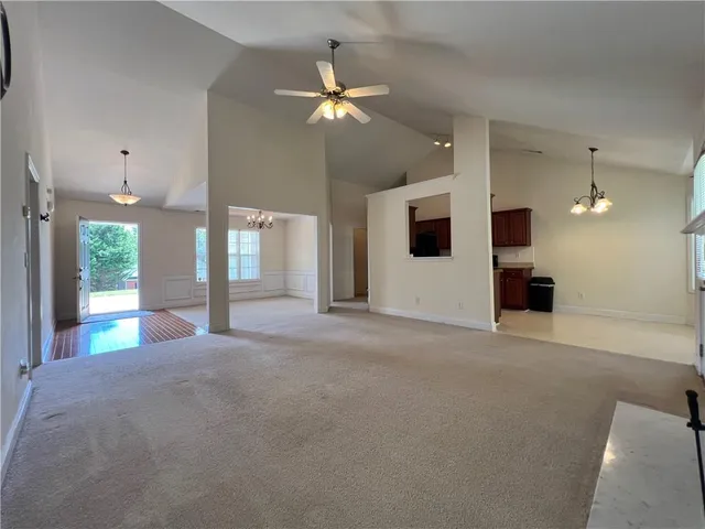 a kitchen with stainless steel appliances granite countertop a sink dishwasher a refrigerator a stove and a microwave oven with cabinets