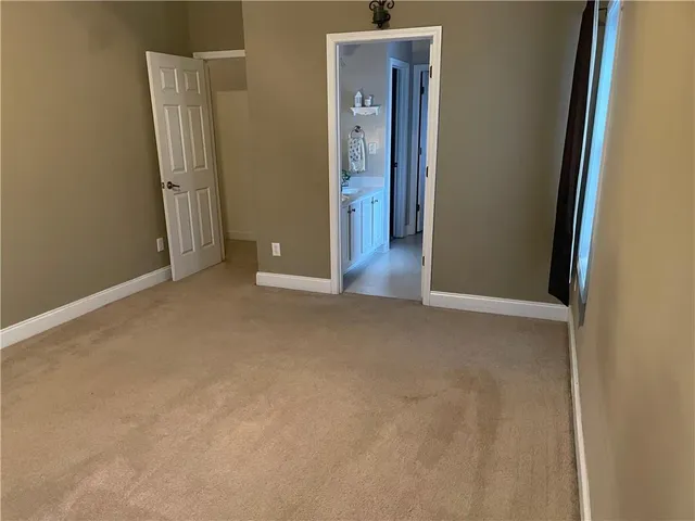 a view of storage and utility room with racks on the wall