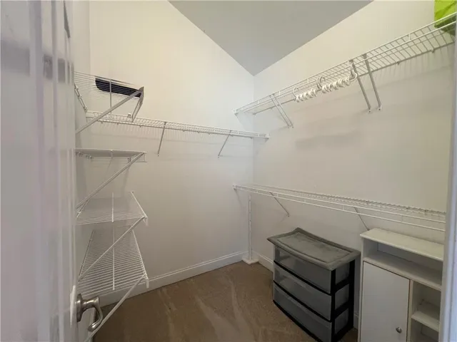 a room with lots of furniture and racks