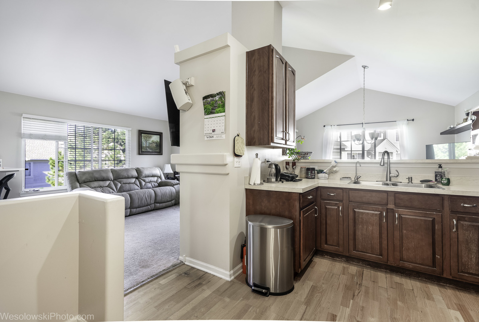 644 South Rosehall Lane, Unit 644 Round Lake, IL 60073 - Photo 11 of 33 a kitchen with sink a stove and cabinets