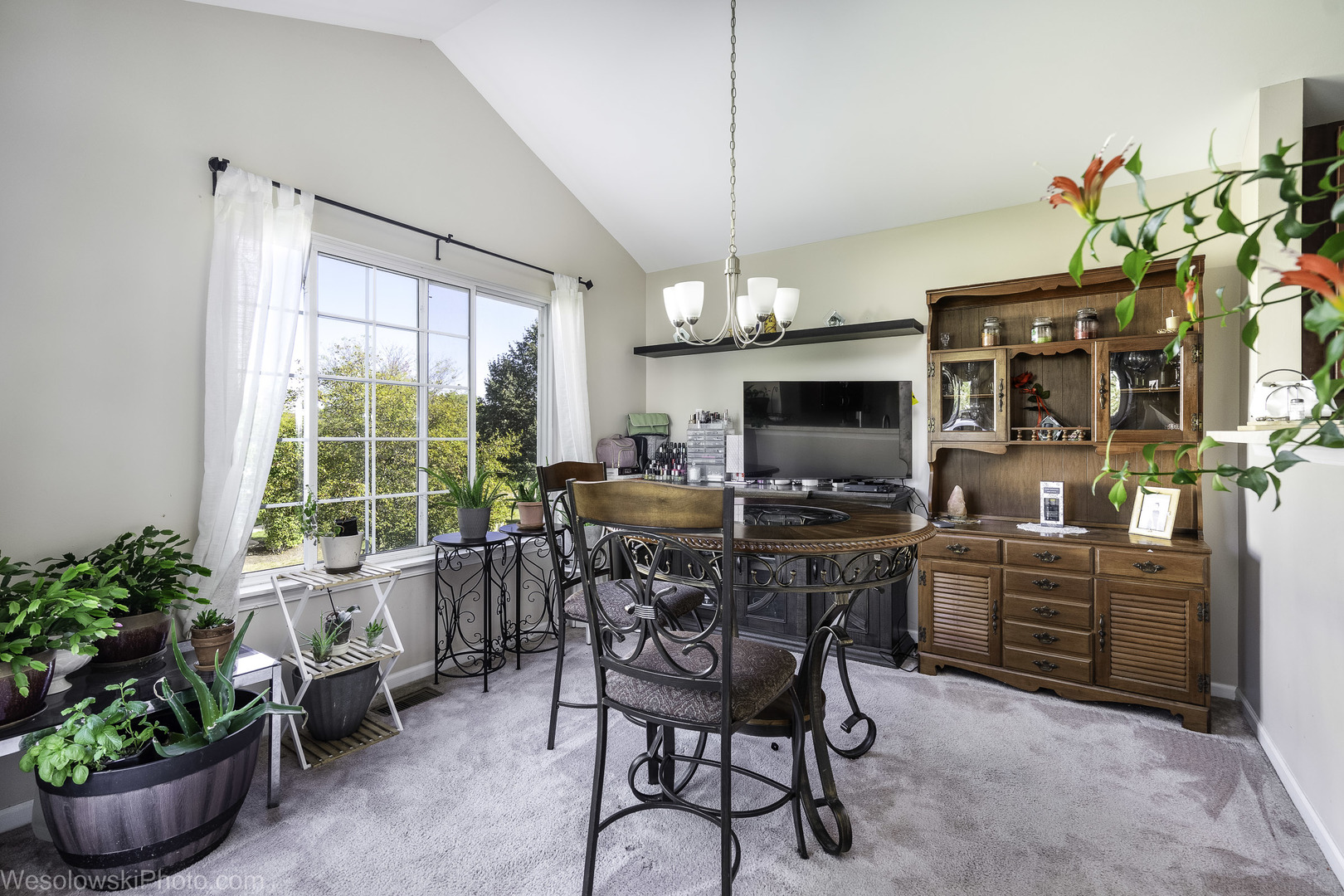 644 South Rosehall Lane, Unit 644 Round Lake, IL 60073 - Photo 12 of 33 a view of a dining room with furniture window and outside view