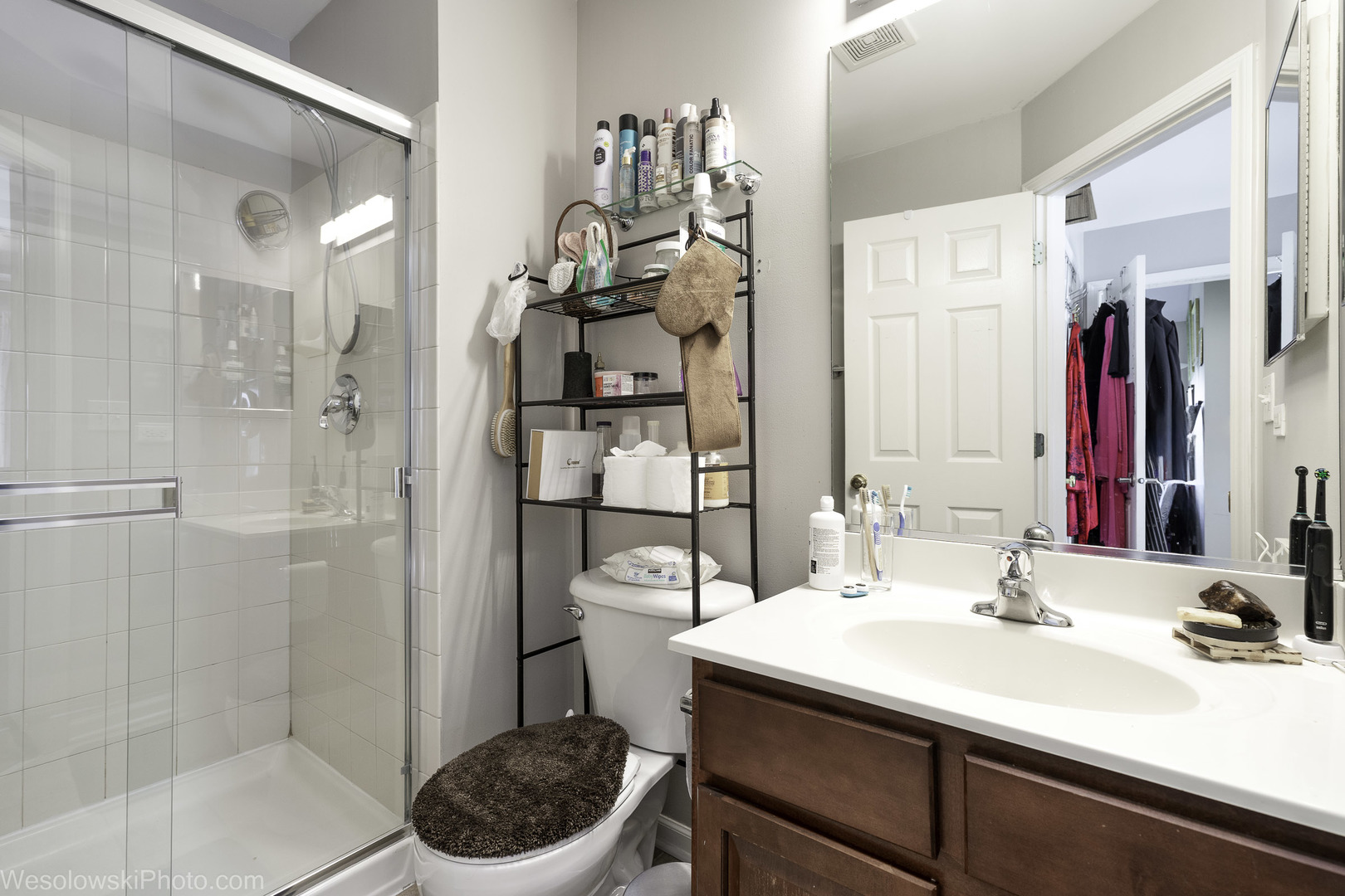 644 South Rosehall Lane, Unit 644 Round Lake, IL 60073 - Photo 15 of 33 a bathroom with a sink a toilet and shower