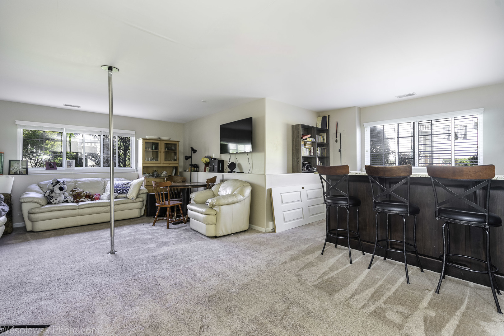 644 South Rosehall Lane, Unit 644 Round Lake, IL 60073 - Photo 18 of 33 a living room with furniture and a large window