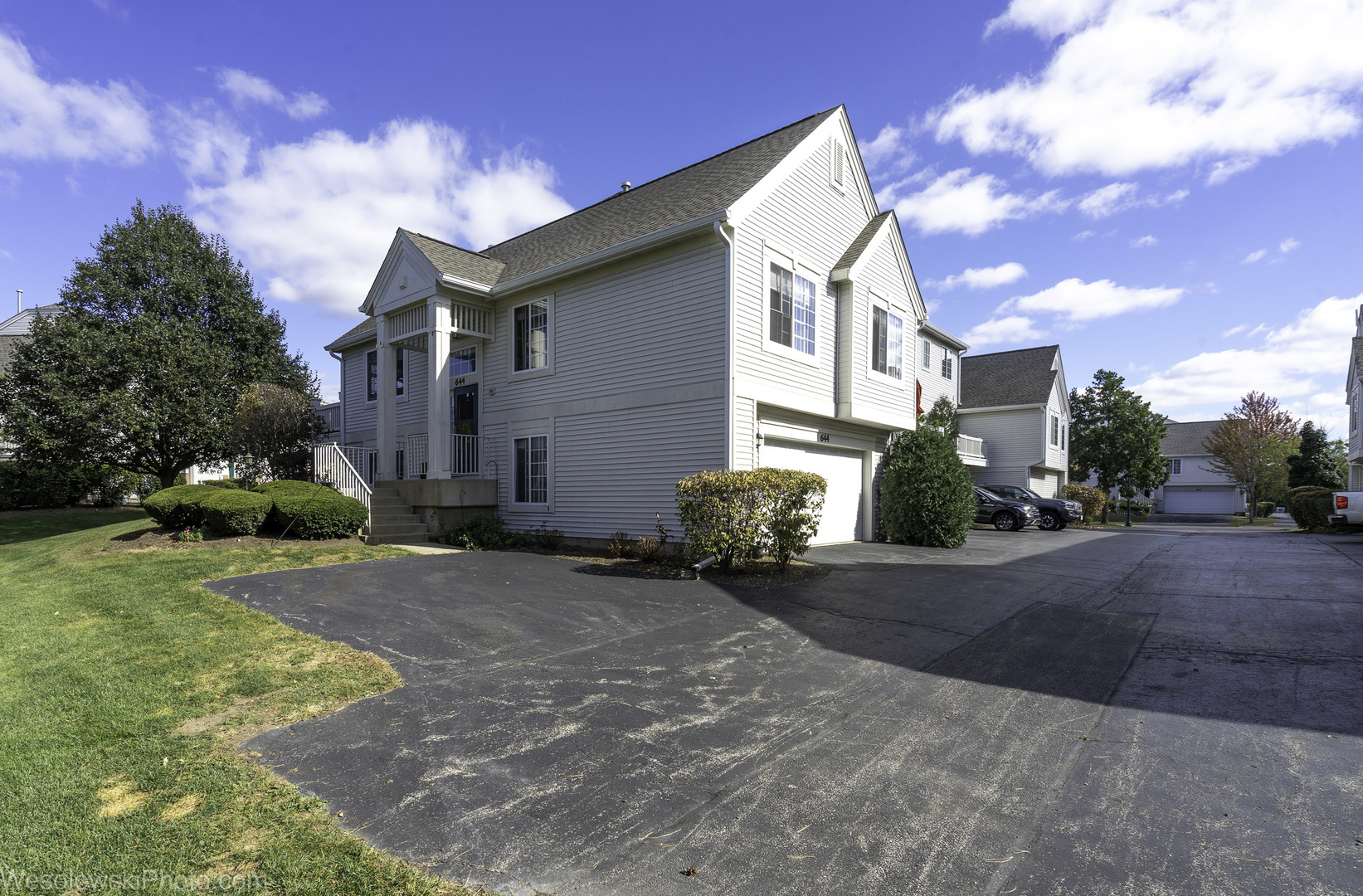 644 South Rosehall Lane, Unit 644 Round Lake, IL 60073 - Photo 27 of 33 a view of a house with backyard and garden