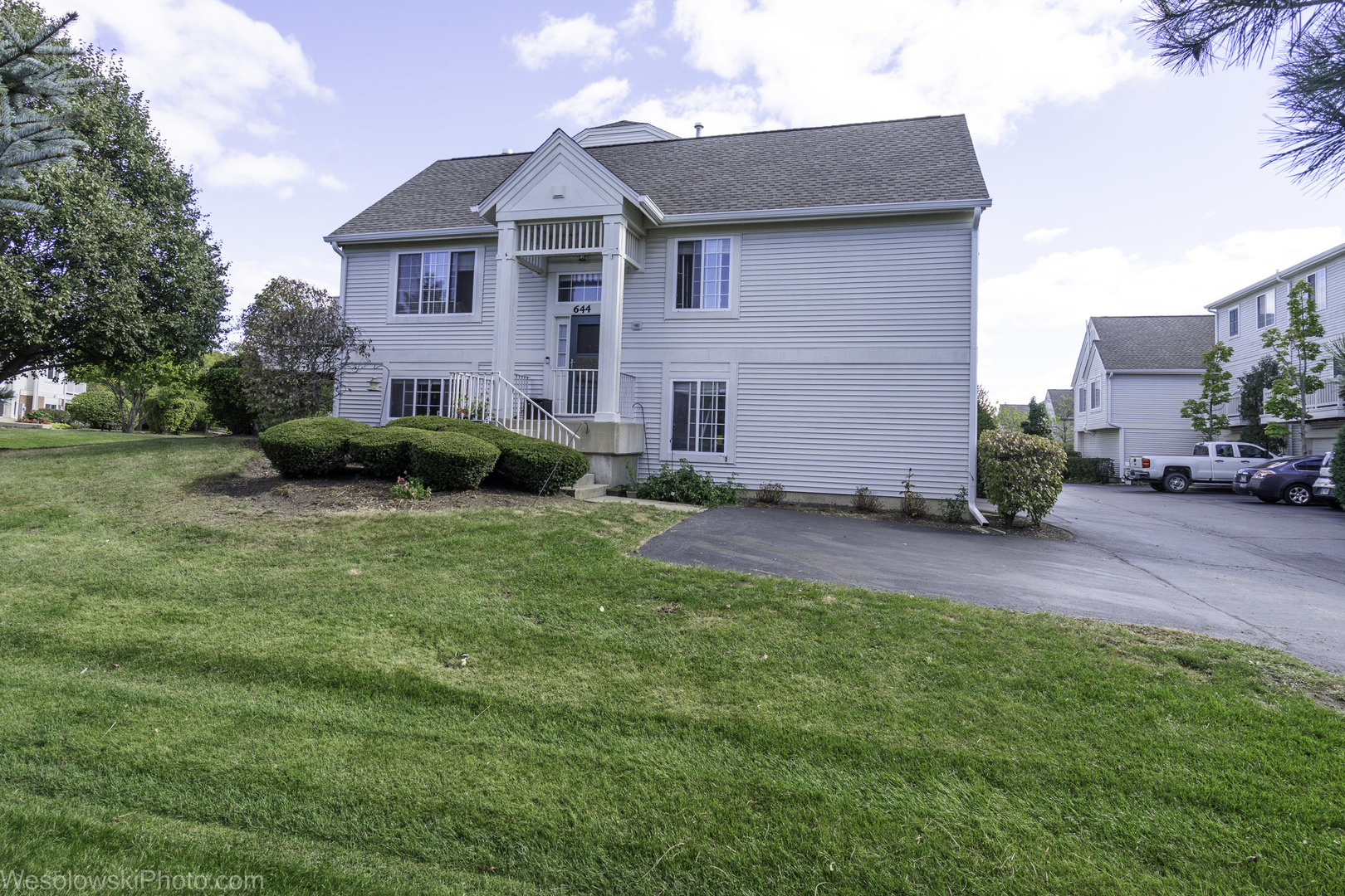 644 South Rosehall Lane, Unit 644 Round Lake, IL 60073 - Photo 28 of 33 a front view of a house with garden