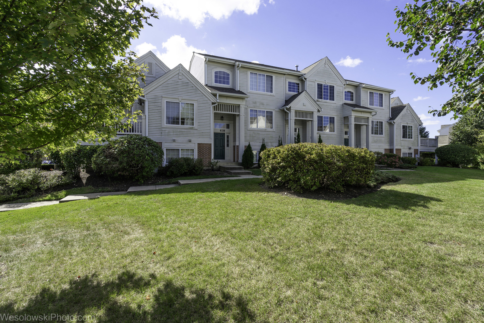 644 South Rosehall Lane, Unit 644 Round Lake, IL 60073 - Photo 29 of 33 a front view of a house with a yard
