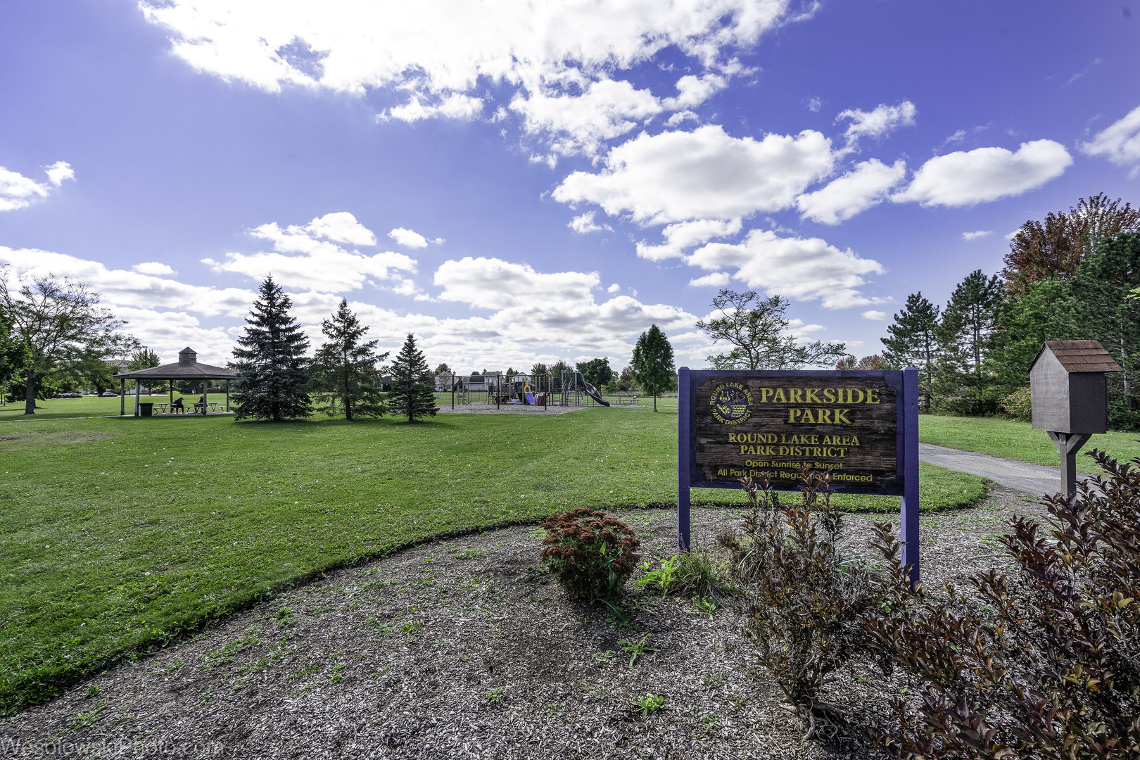 644 South Rosehall Lane, Unit 644 Round Lake, IL 60073 - Photo 31 of 33 a view of a garden with sitting area