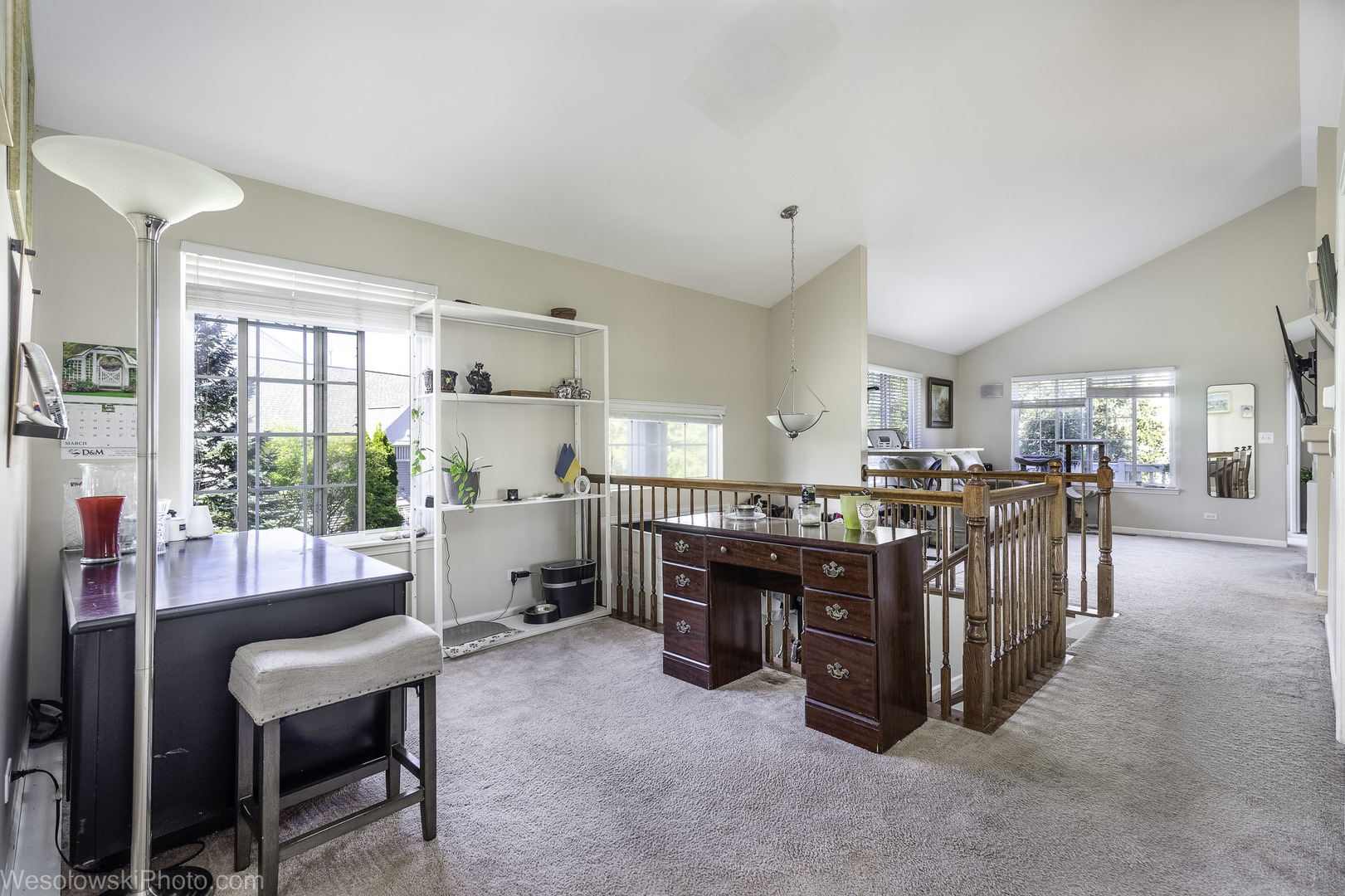 644 South Rosehall Lane, Unit 644 Round Lake, IL 60073 - Photo 7 of 33 a living room with furniture and a dining table with wooden floor