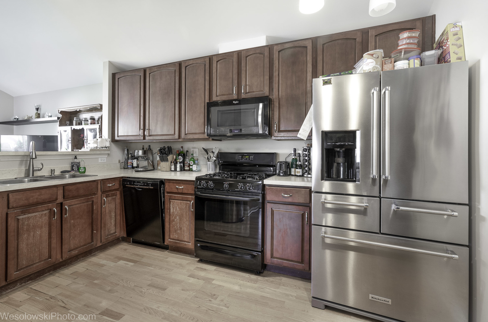 644 South Rosehall Lane, Unit 644 Round Lake, IL 60073 - Photo 9 of 33 a kitchen with stainless steel appliances and refrigerator