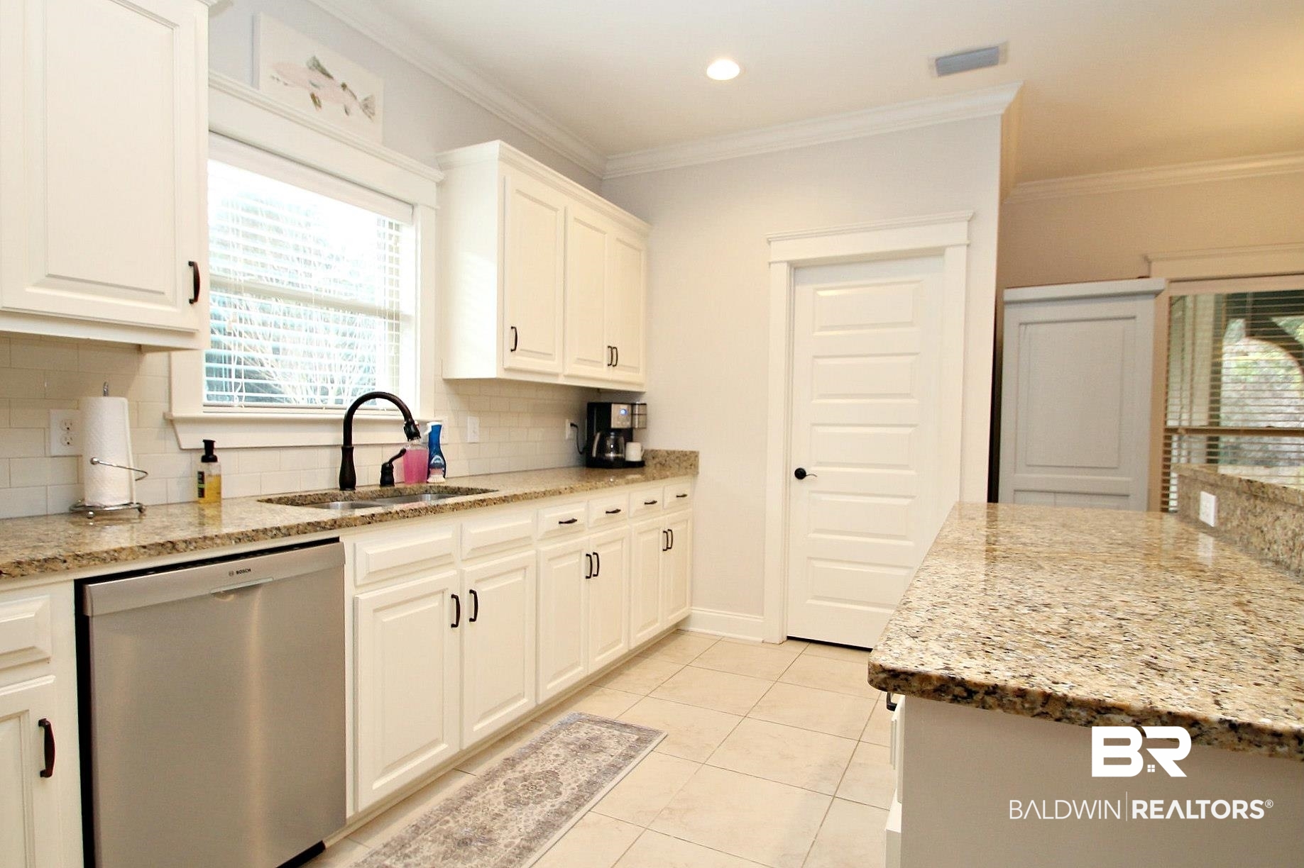 30232 Persimmon Drive Daphne, AL 36527 - Photo 9 of 27 Kitchen with visible vents, white cabinets, dishwasher, light stone countertops, and a sink