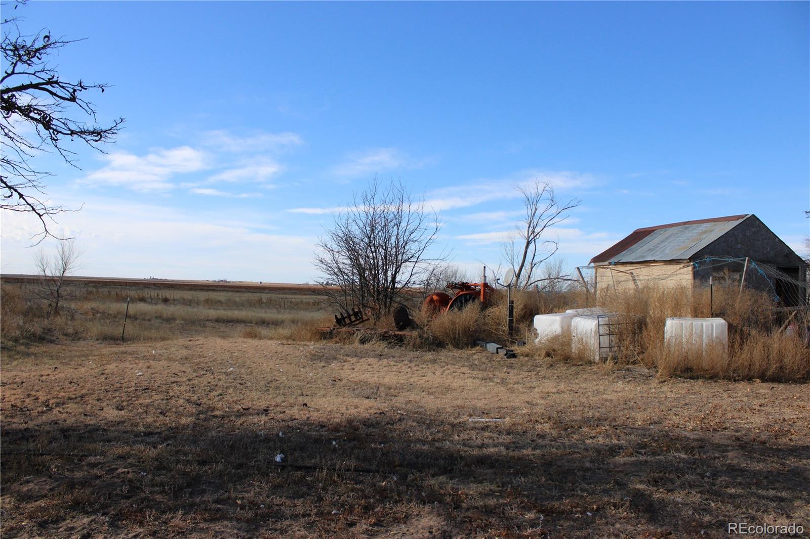 1901 County Road East Joes, CO 80822 - Photo 20 of 42 a view of a dry yard with wooden fence