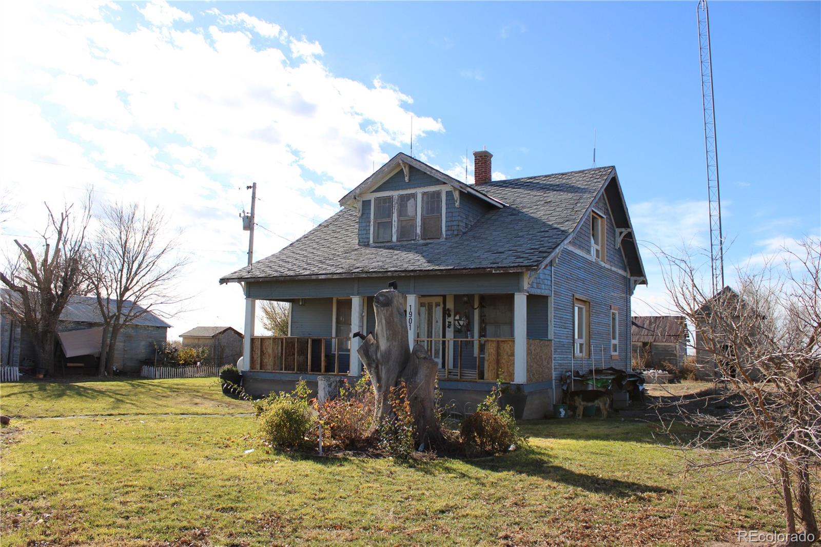 1901 County Road East Joes, CO 80822 - Photo 2 of 42 a front view of a house with garden