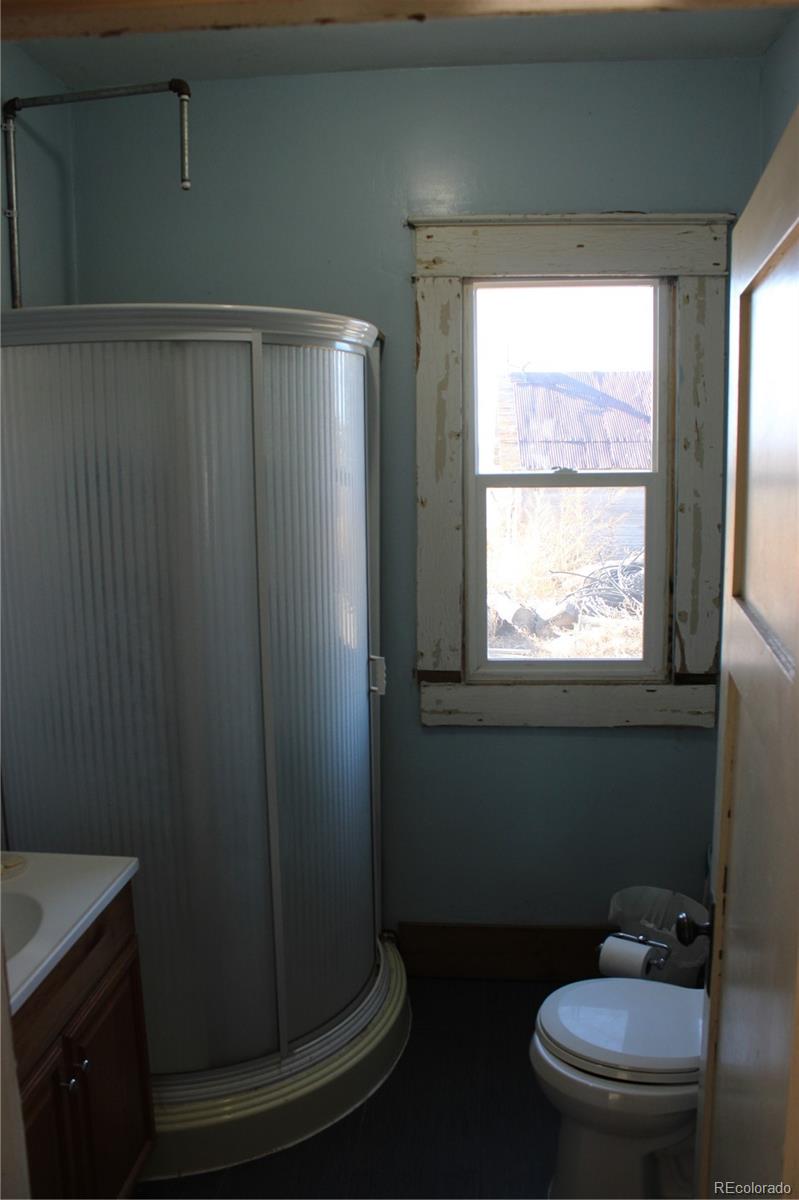 1901 County Road East Joes, CO 80822 - Photo 30 of 42 a bathroom with a toilet and a sink