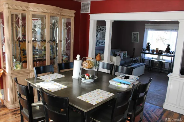 a kitchen with a refrigerator and cabinets