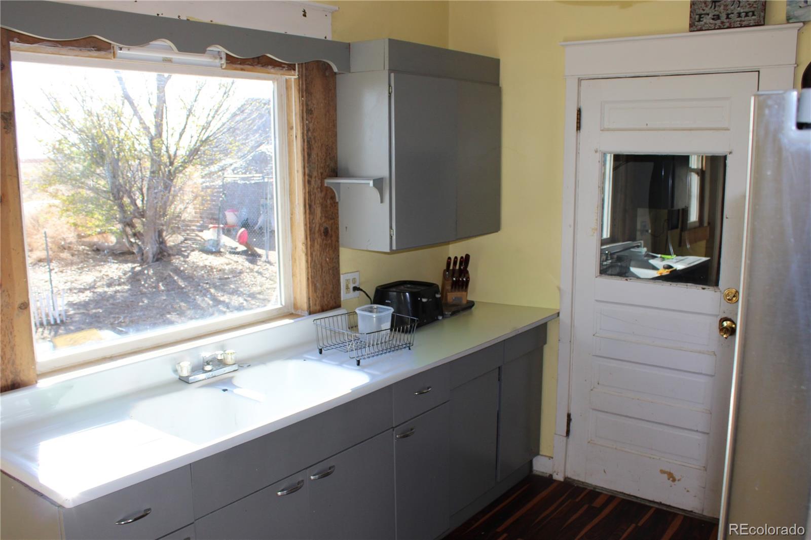 1901 County Road East Joes, CO 80822 - Photo 37 of 42 a bathroom with a sink and a mirror