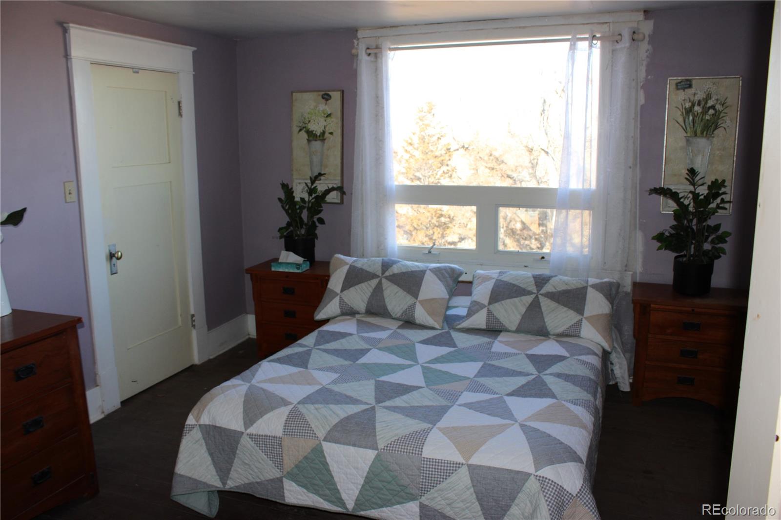1901 County Road East Joes, CO 80822 - Photo 39 of 42 a bedroom with a bed and a window