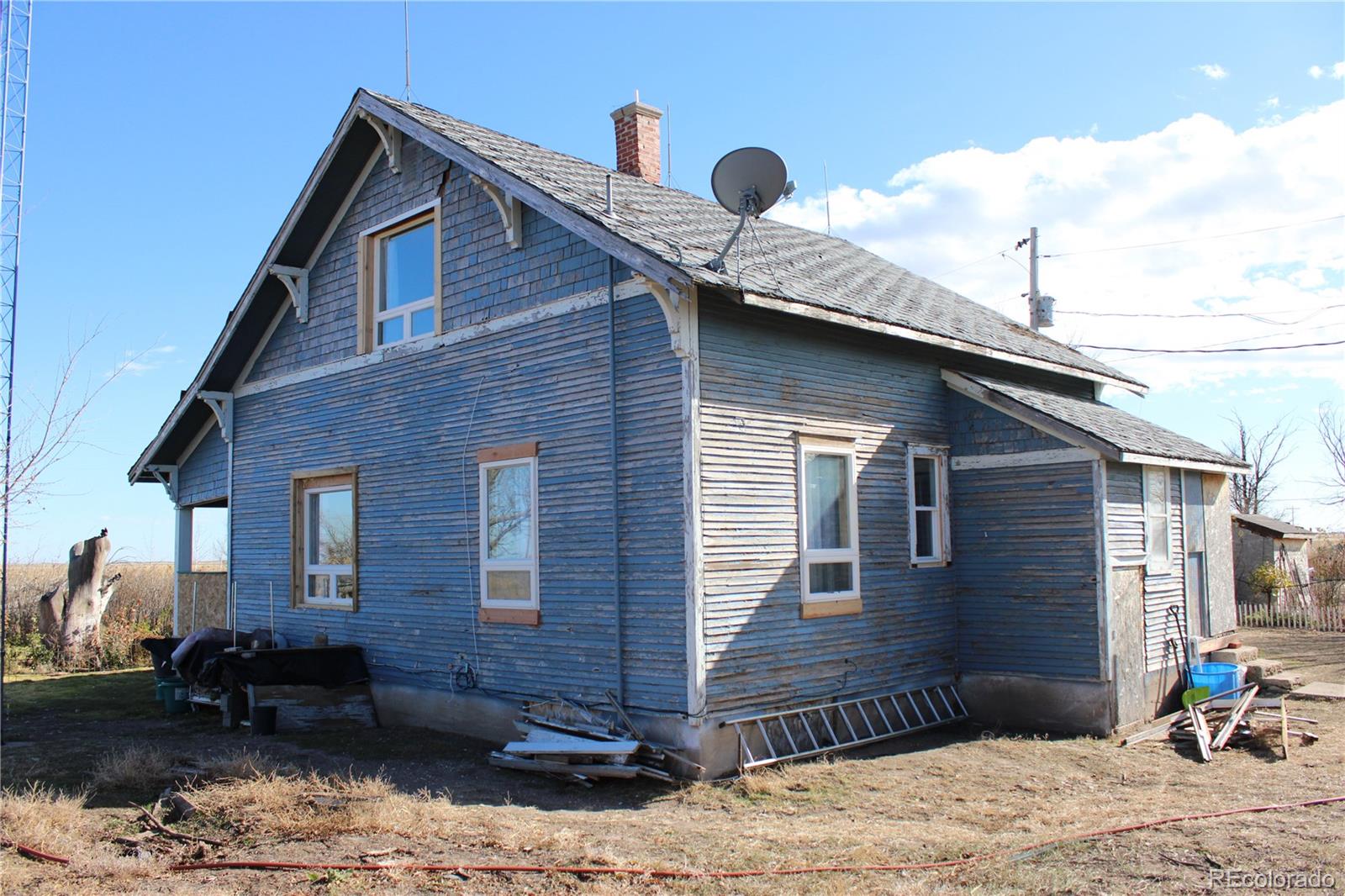 1901 County Road East Joes, CO 80822 - Photo 4 of 42 a front view of a house with garden