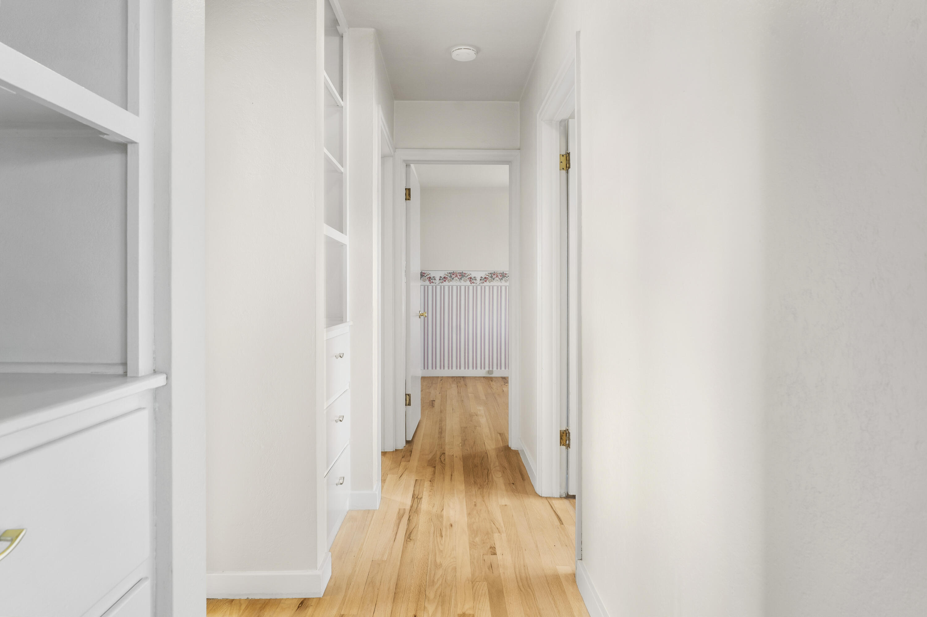 946 Southwest 13th Street Redmond, OR 97756 - Photo 23 of 49 a view of a room with wooden floor and a bathroom