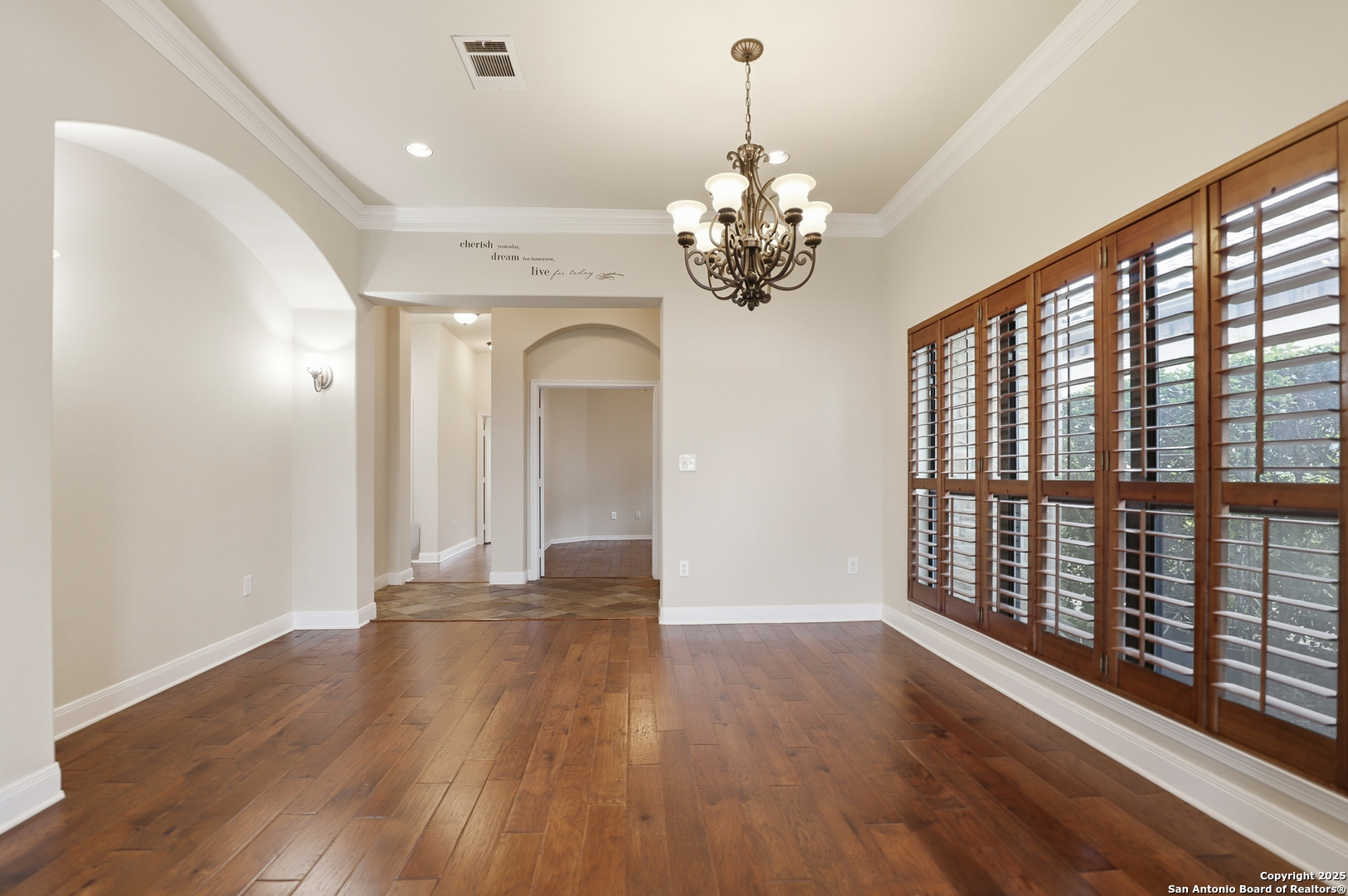 7800 Sw Parkway, Unit 1710 Austin, TX 78735 - Photo 13 of 34 a view of an empty room with wooden floor and a window