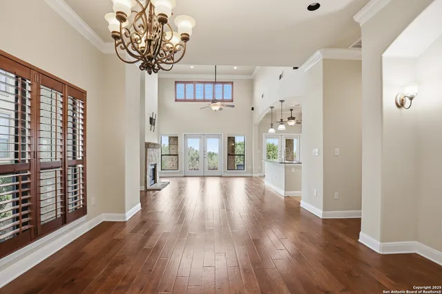 a view of an entryway with wooden floor