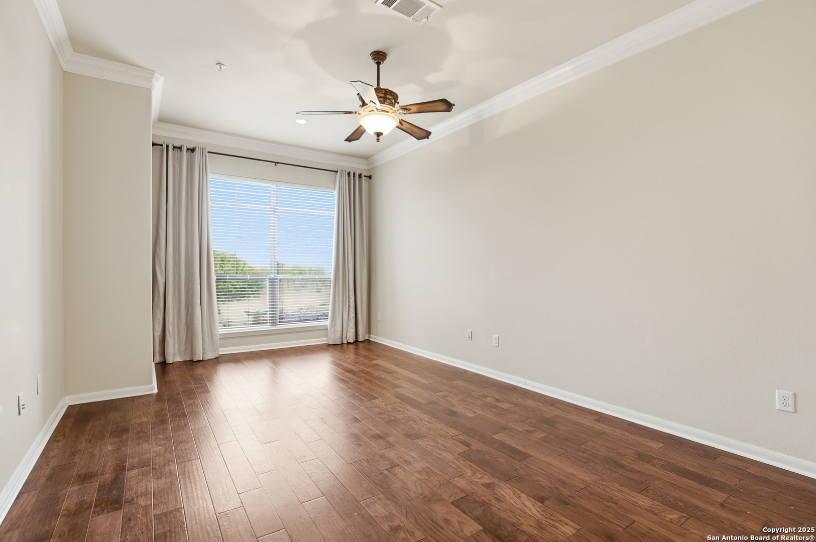 7800 Sw Parkway, Unit 1710 Austin, TX 78735 - Photo 18 of 34 a view of an empty room with wooden floor and a window