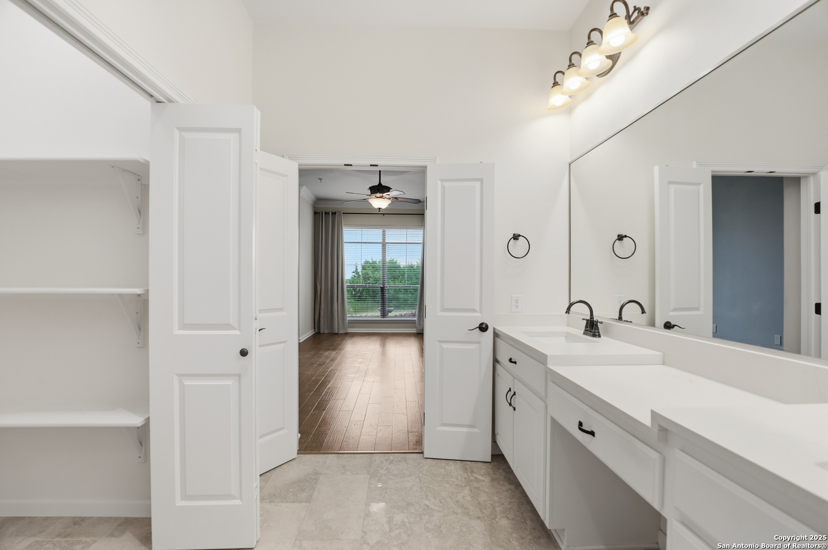 7800 Sw Parkway, Unit 1710 Austin, TX 78735 - Photo 20 of 34 a spacious bathroom with a double vanity sink a large mirror and shower