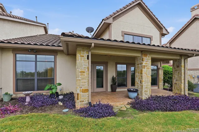 front view of a house with a small yard