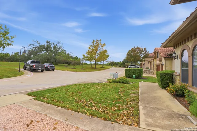 a view of a garden with a building in the background
