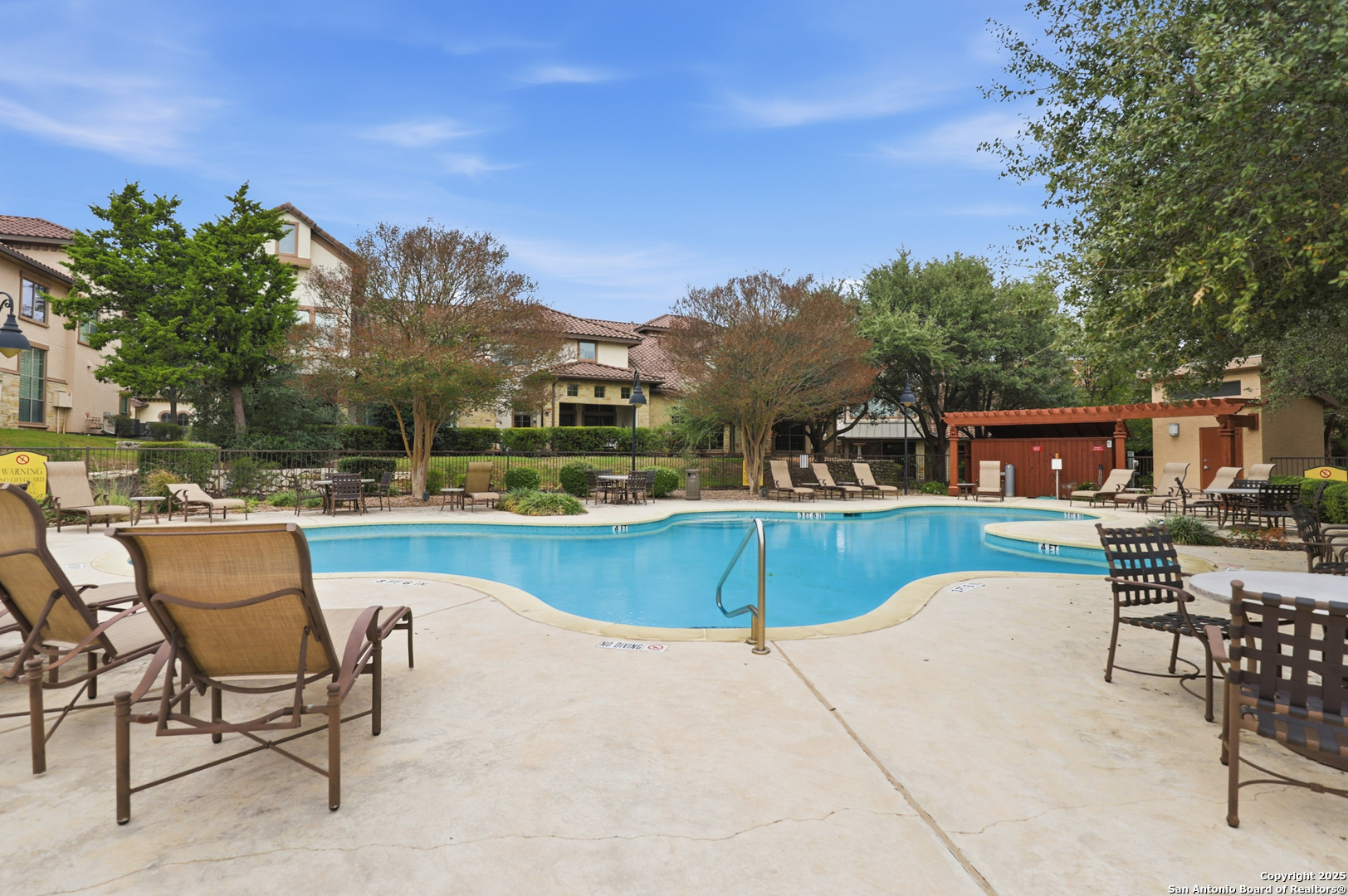 7800 Sw Parkway, Unit 1710 Austin, TX 78735 - Photo 32 of 34 a view of a swimming pool with outdoor seating and plants