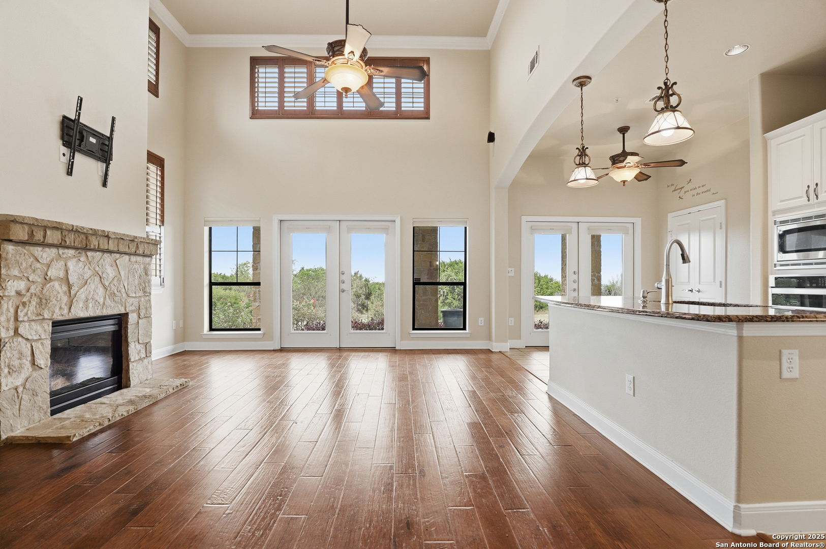 7800 Sw Parkway, Unit 1710 Austin, TX 78735 - Photo 6 of 34 a view of a room with wooden floor and a fireplace