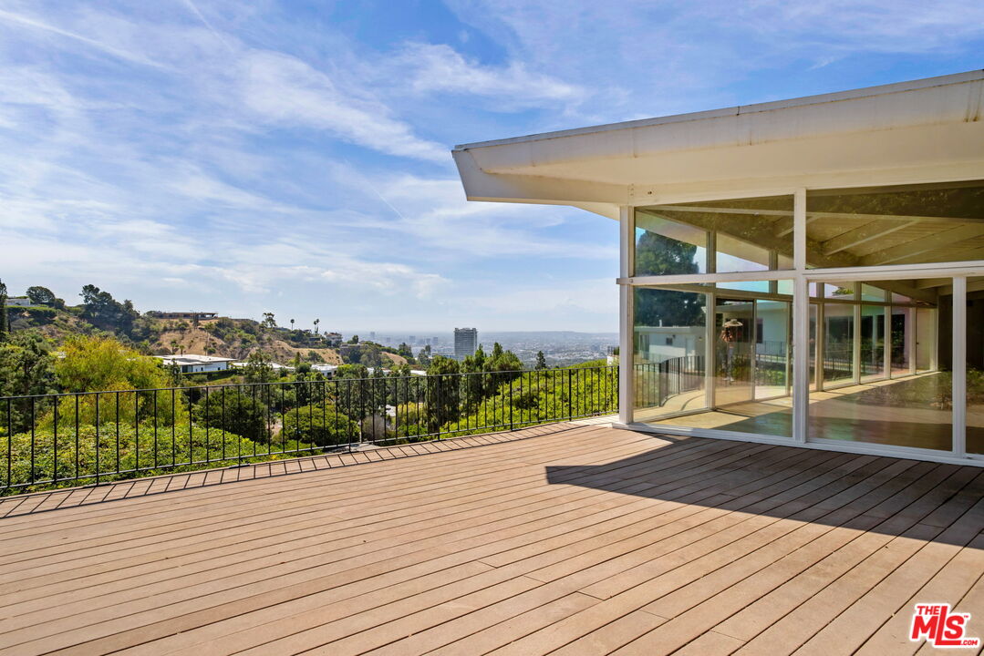 1460 Carla Ridge Beverly Hills, CA 90210 - Photo 11 of 20 a view of a house with a backyard