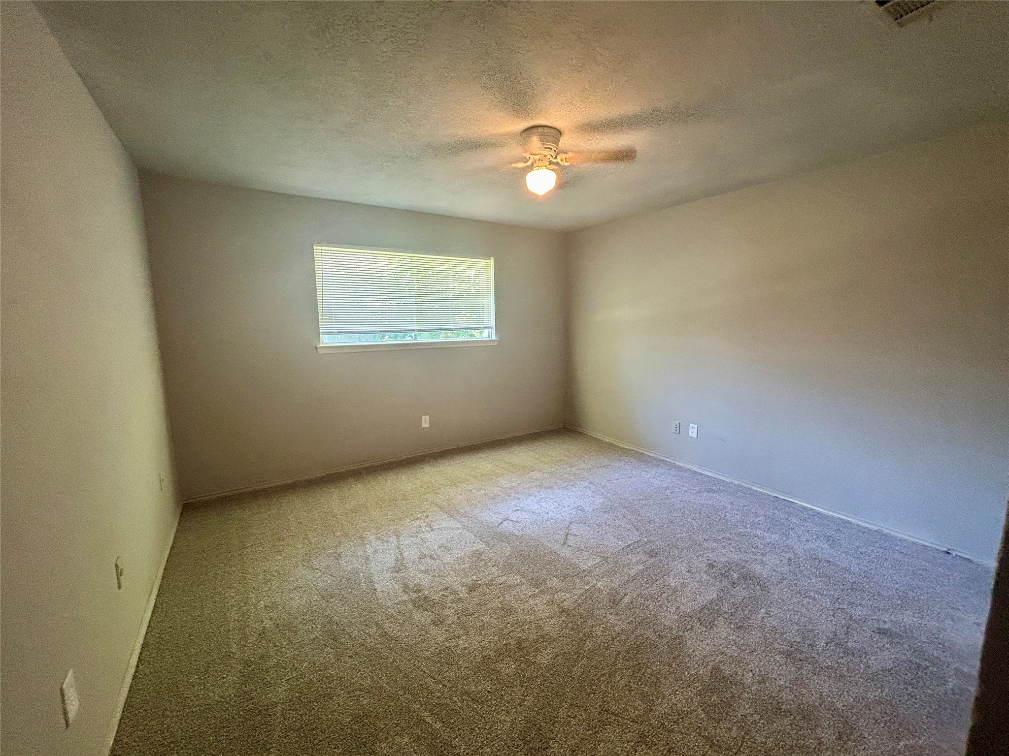 2510 Knollbrook Lane Spring, TX 77373 - Photo 15 of 24 an empty room with a chandelier fan