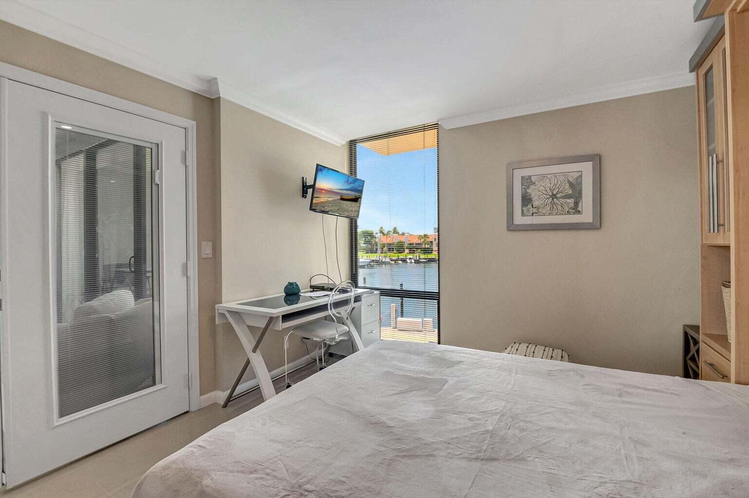 2707 North Ocean Boulevard, Unit D205 Boca Raton, FL 33431 - Photo 28 of 51 a bed room with a bed and a window
