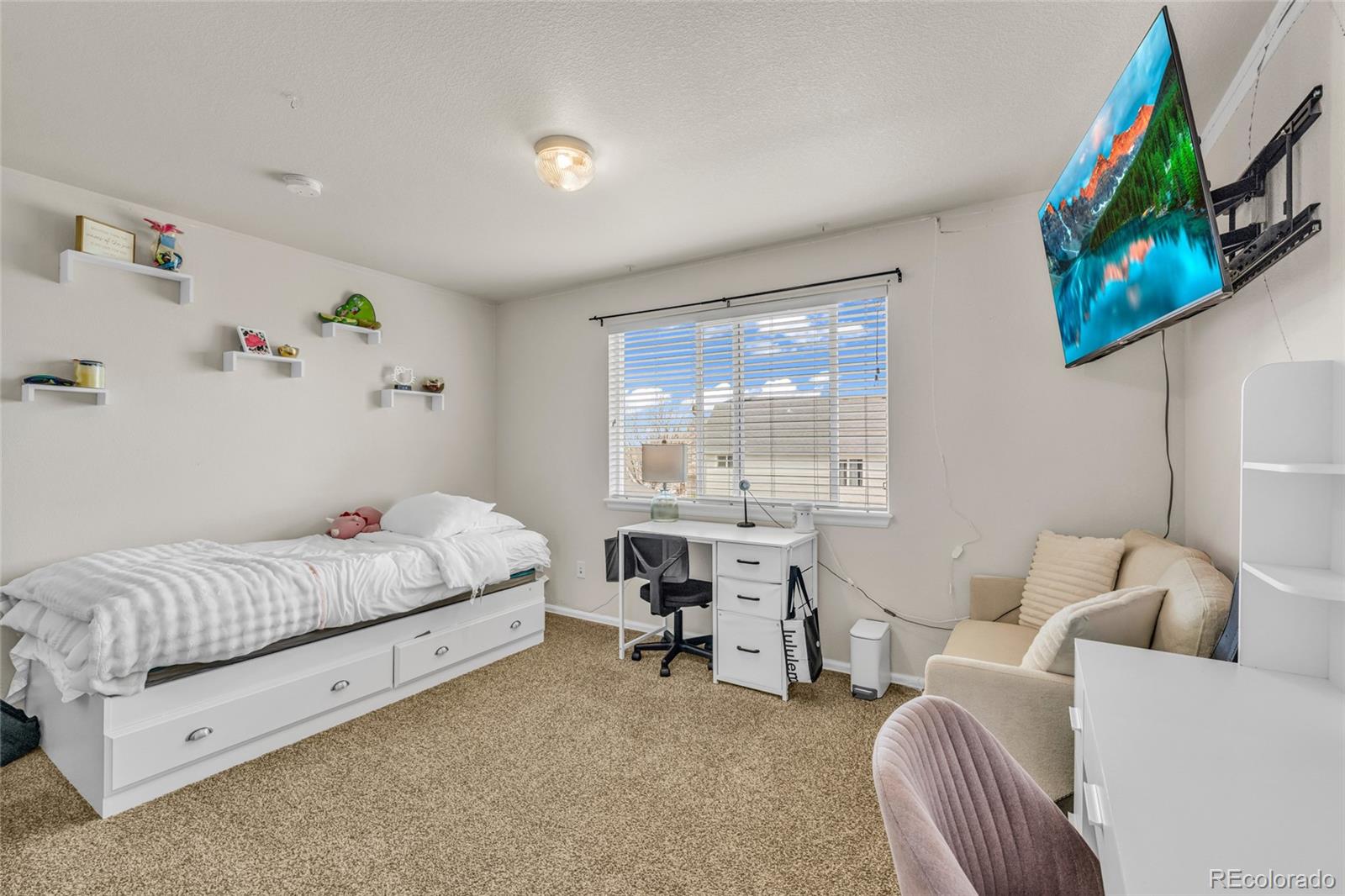 6132 Graden Street Frederick, CO 80530 - Photo 16 of 28 a bedroom with furniture and a large window