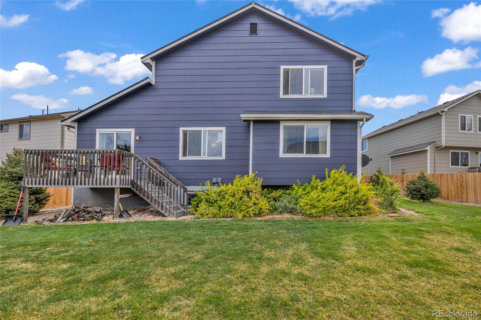 6132 Graden Street Frederick, CO 80530 - Photo 27 of 28 a front view of a house with garden