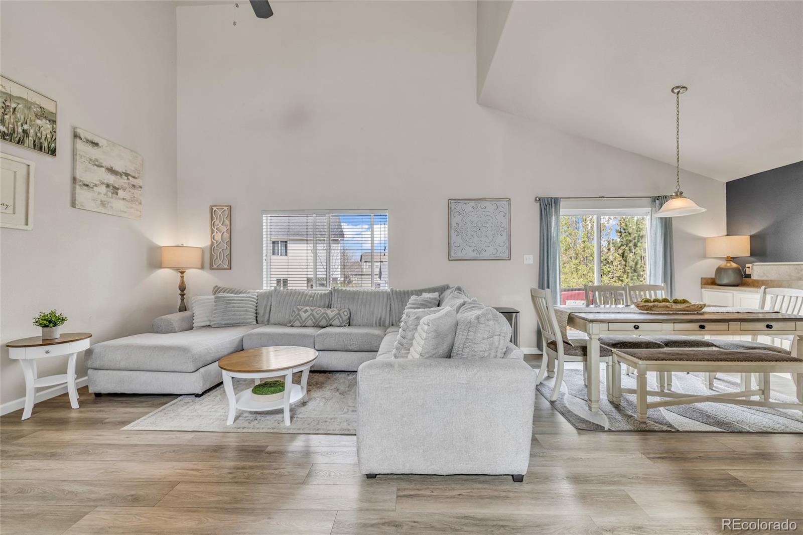 6132 Graden Street Frederick, CO 80530 - Photo 6 of 28 a living room with furniture and a large window