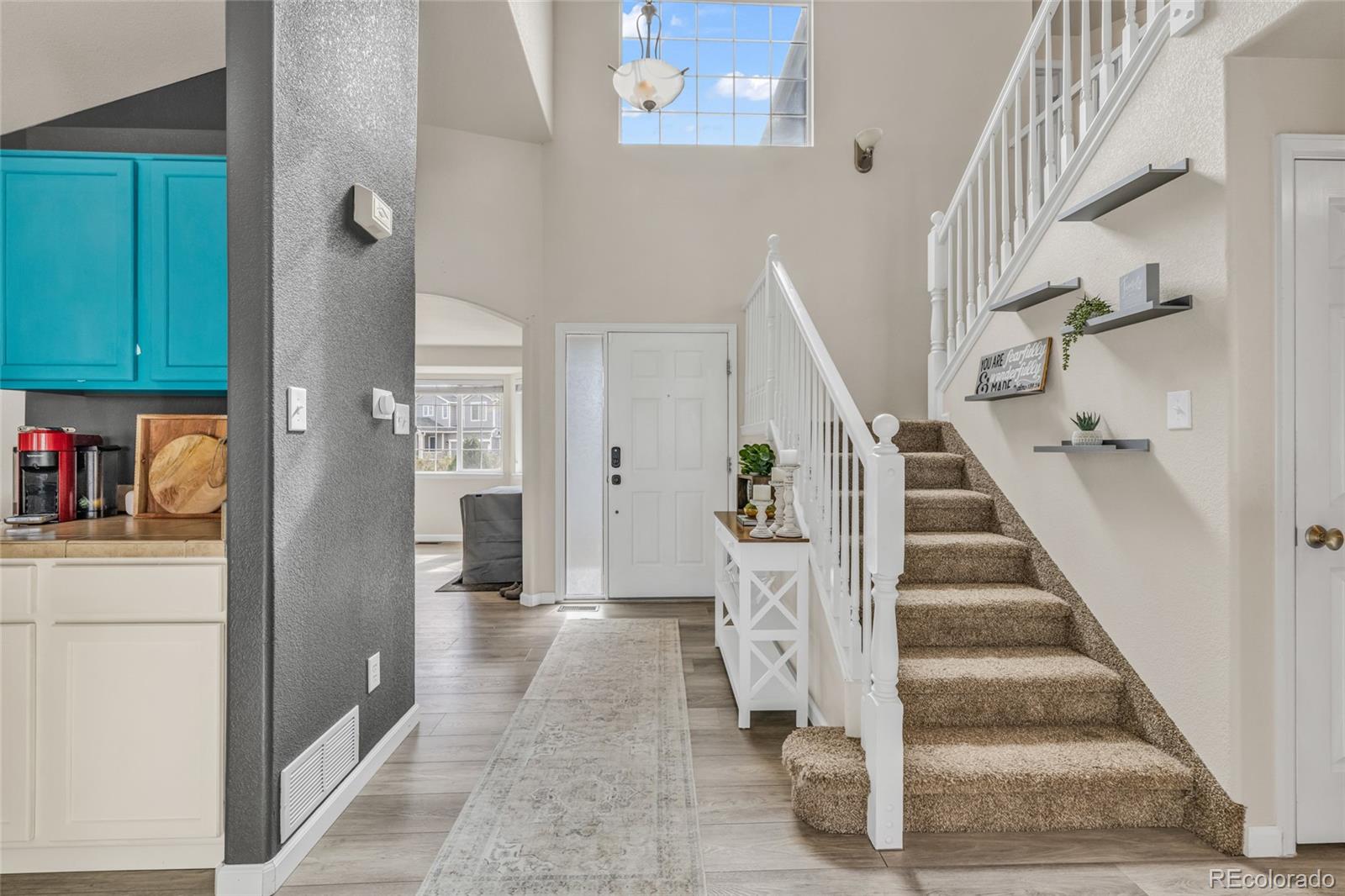 6132 Graden Street Frederick, CO 80530 - Photo 8 of 28 a view of entryway and hall with wooden floor
