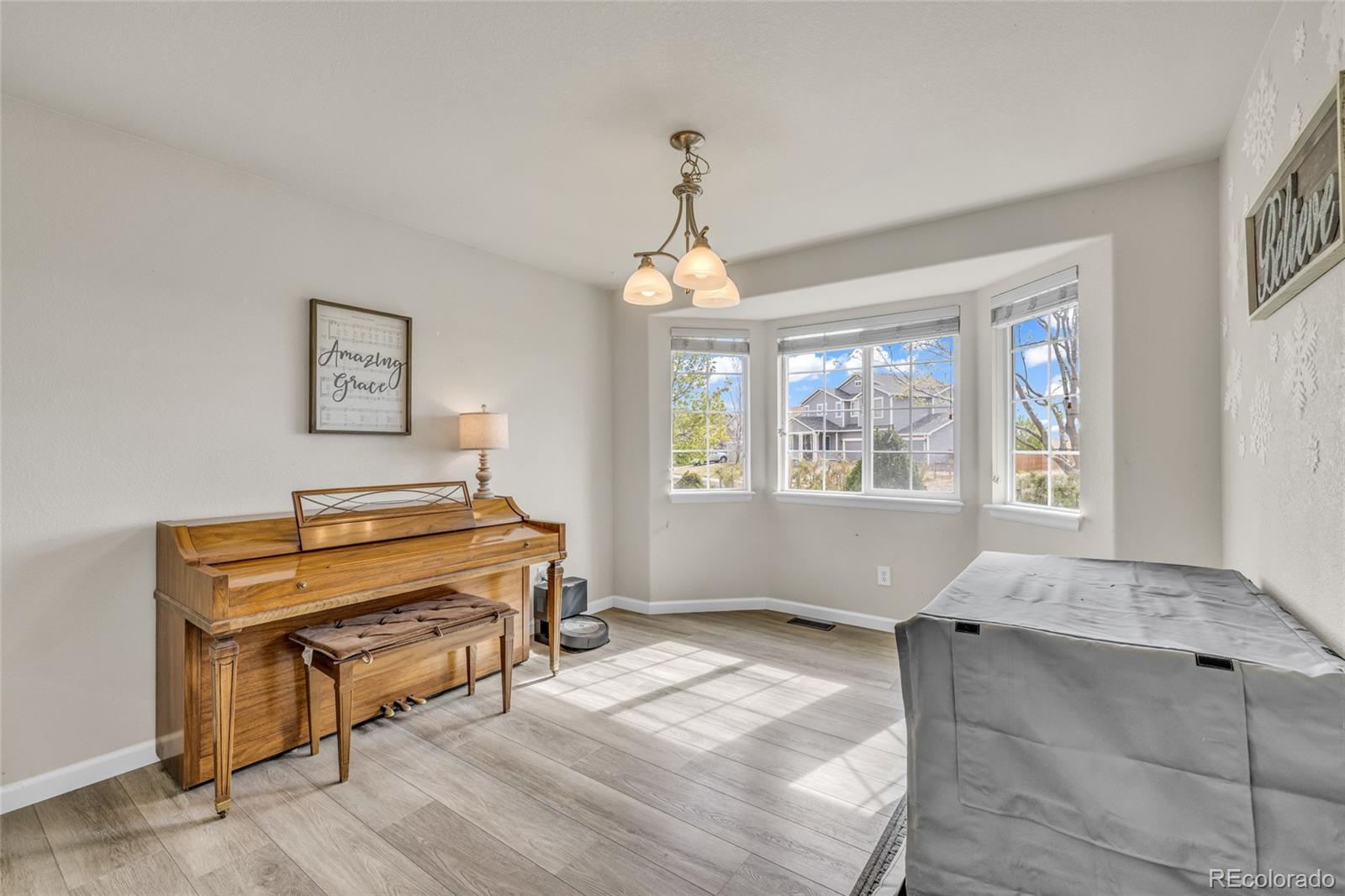 6132 Graden Street Frederick, CO 80530 - Photo 9 of 28 a bedroom with furniture and a window