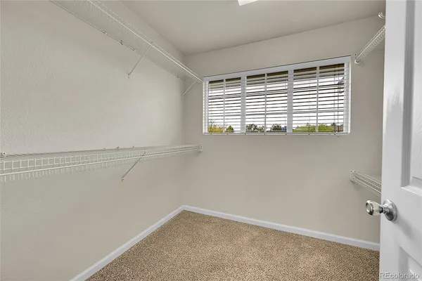a view of a small space with racks on the wall
