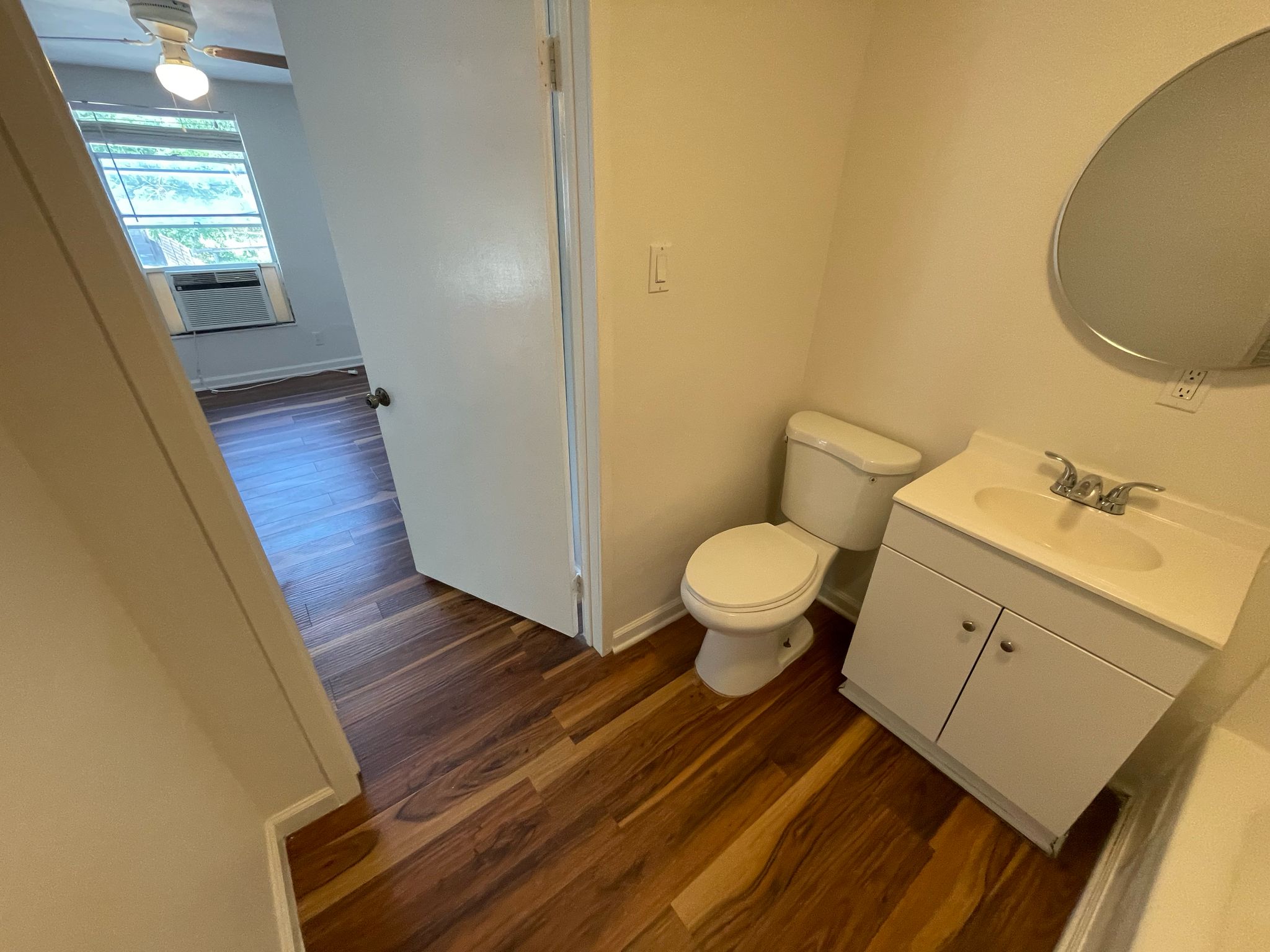 6404 Ponca Street, Unit B Austin, TX 78741 - Photo 14 of 17 a bathroom with a sink and a mirror