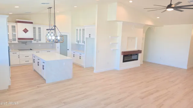a large spacious bathroom with a tub double vanity sink and mirror