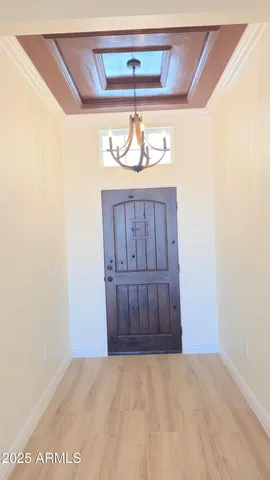 a view of a door and an entryway in a hall