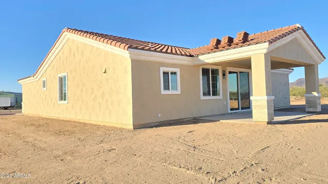 a view of a house with a building
