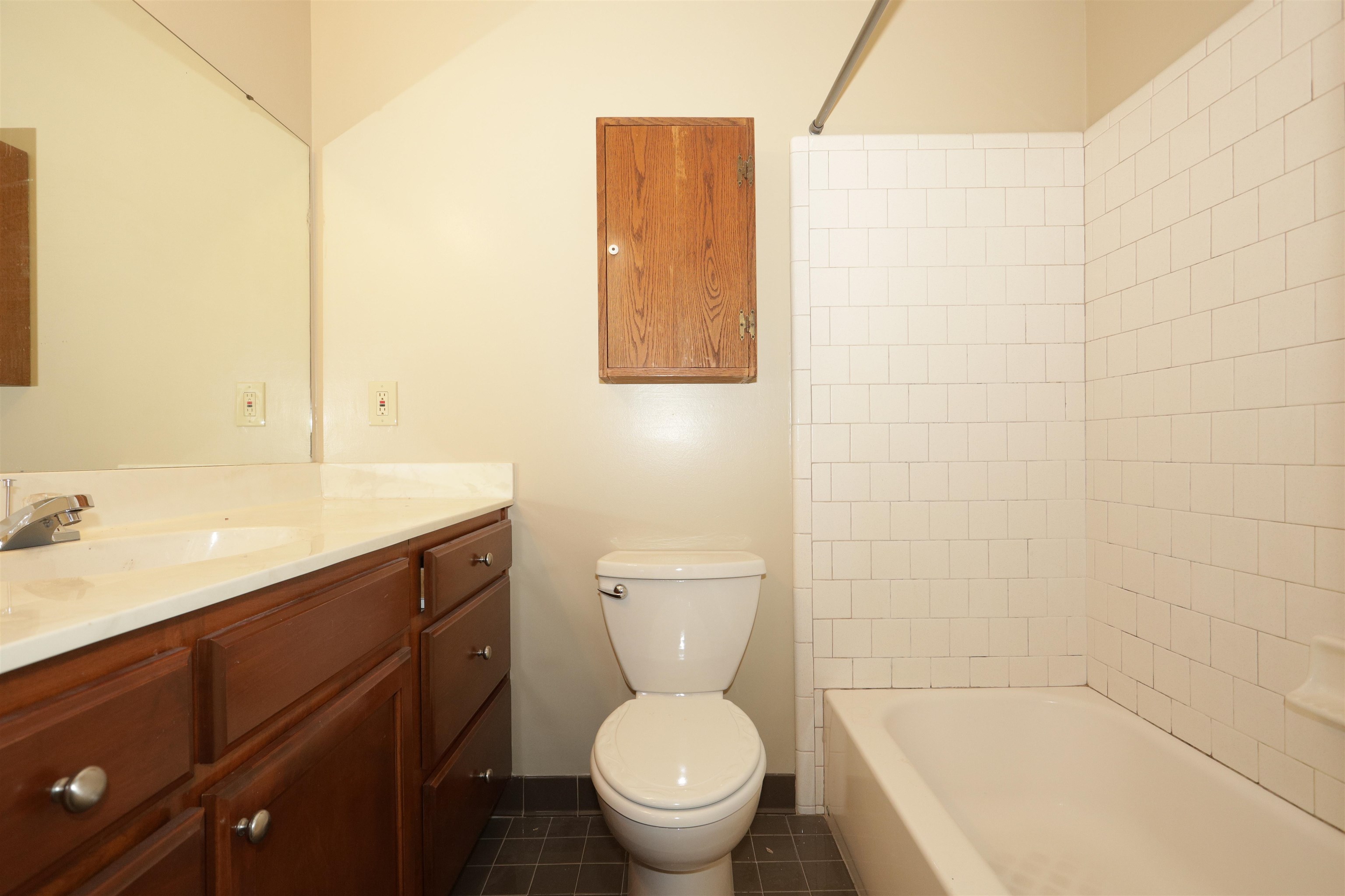 3164 Raleigh Ridge Drive Memphis, TN 38128 - Photo 11 of 15 a bathroom with a sink a toilet and a mirror