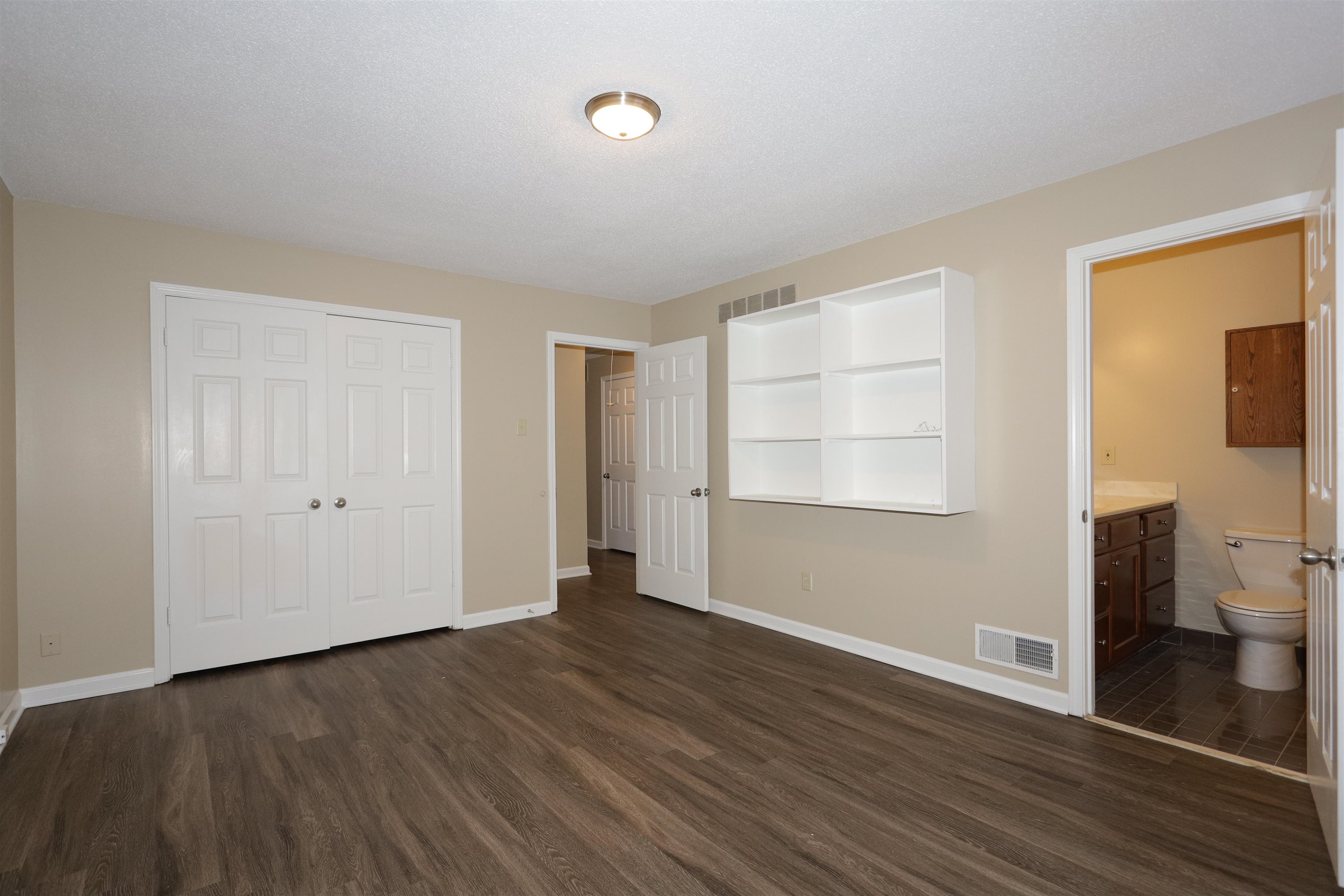 3164 Raleigh Ridge Drive Memphis, TN 38128 - Photo 13 of 15 a view of a room with wooden floor and windows