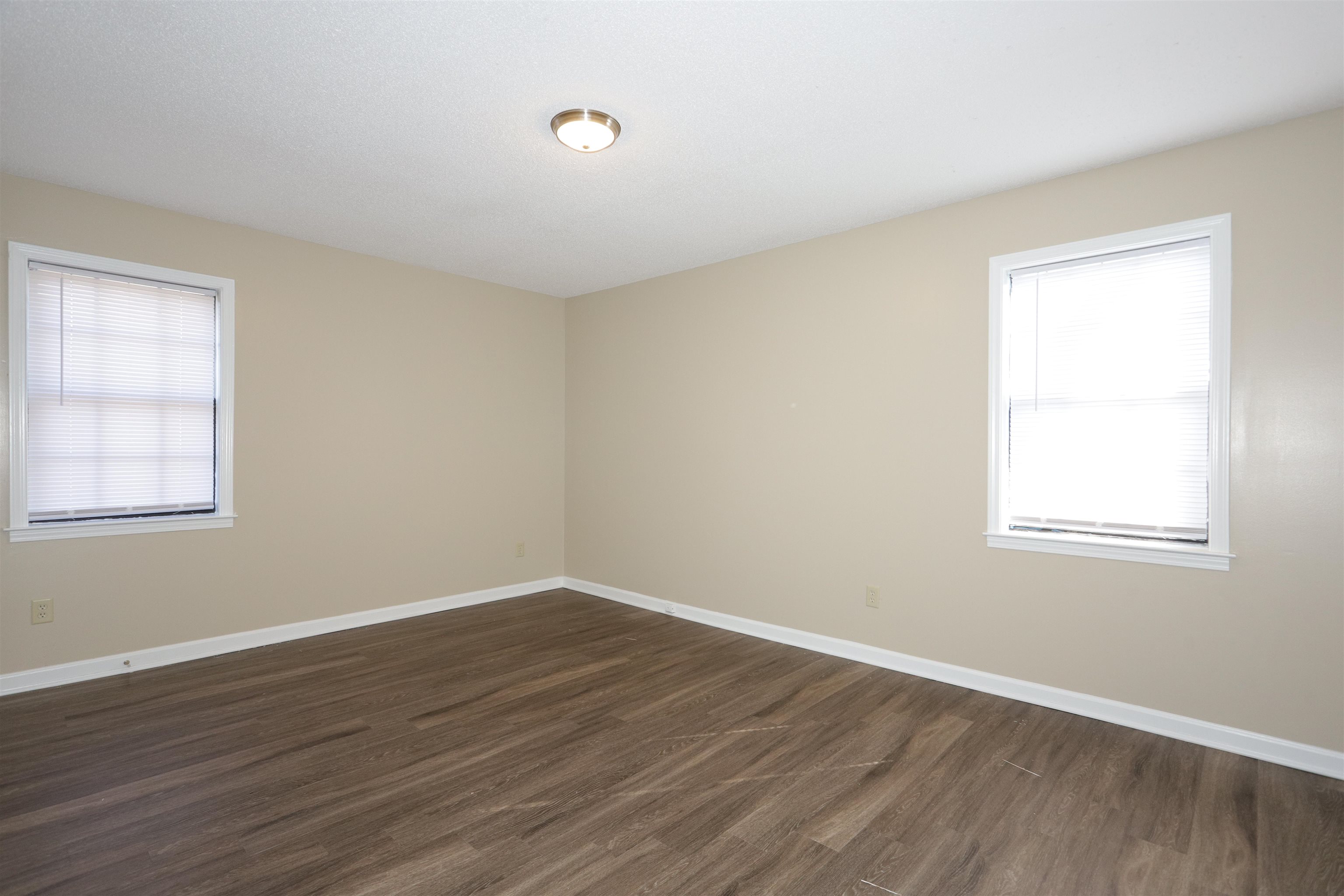 3164 Raleigh Ridge Drive Memphis, TN 38128 - Photo 15 of 15 a view of a room with wooden floor and windows in it
