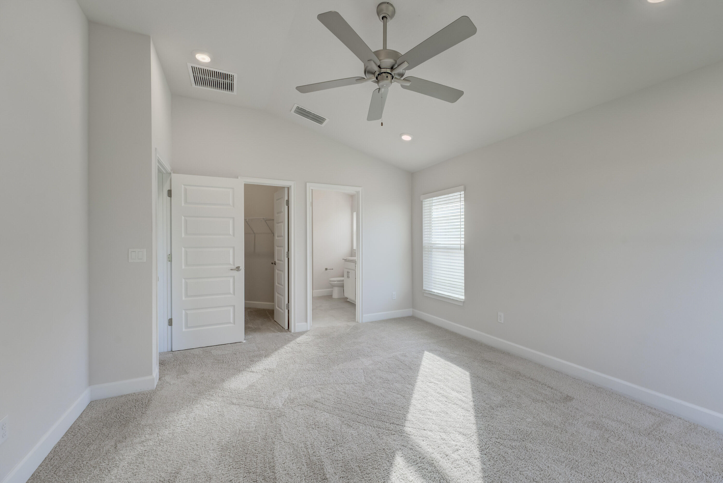 5327 Vespera Street Fort Pierce, FL 34951 - Photo 13 of 27 an empty room with fan and windows