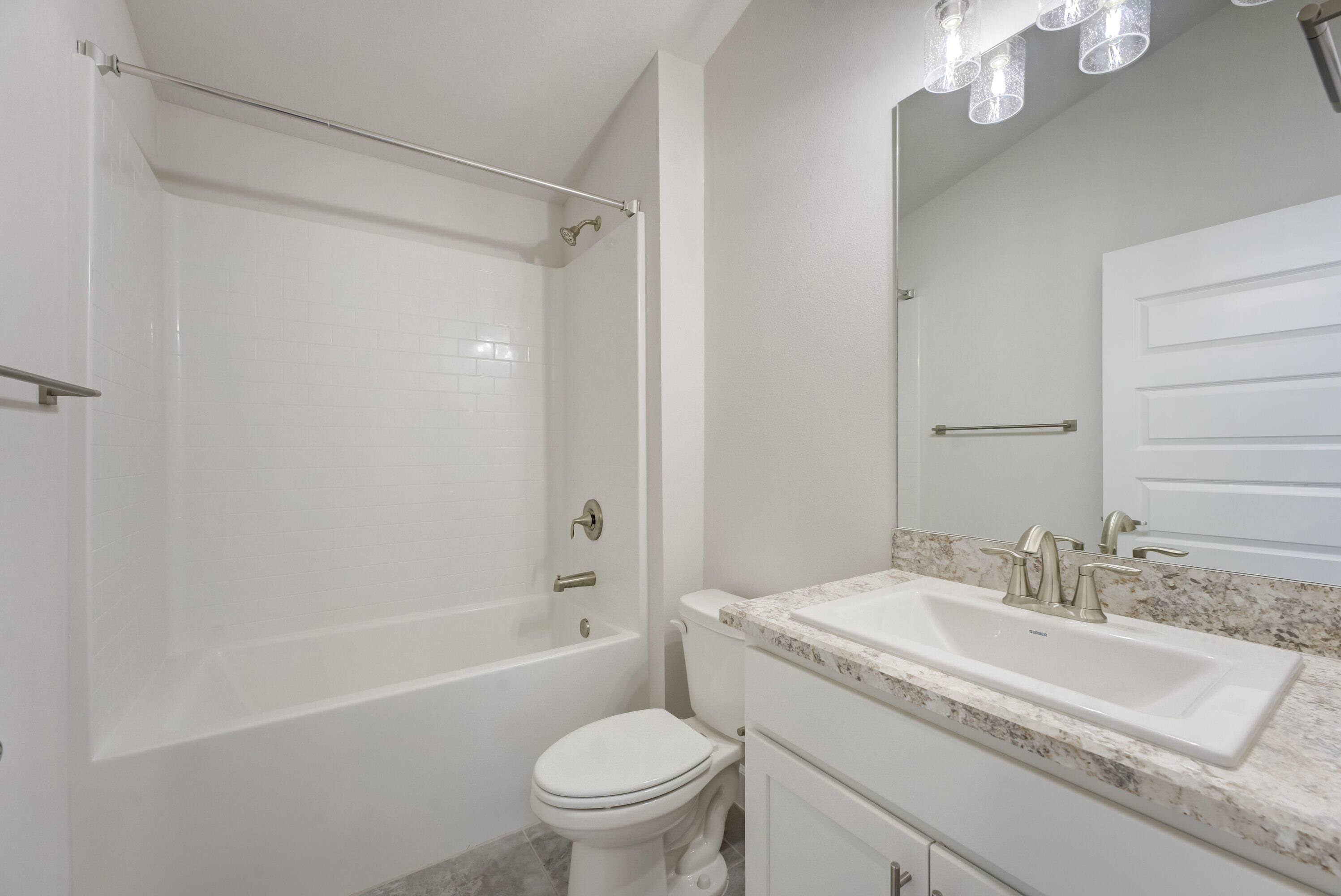 5327 Vespera Street Fort Pierce, FL 34951 - Photo 20 of 27 a bathroom with a granite countertop sink a toilet and shower